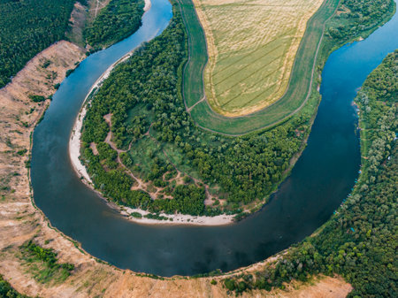 aerial landscape of winding river in green field, top view of beautiful nature texture from drone