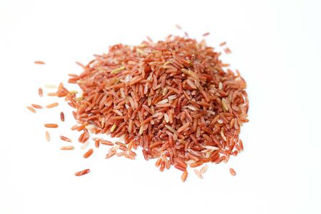 Close up of organic brown jasmine rice isolated on white background.の写真素材
