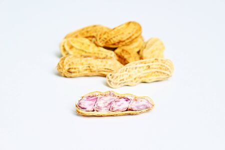 Close up of steamed peanuts on white background.