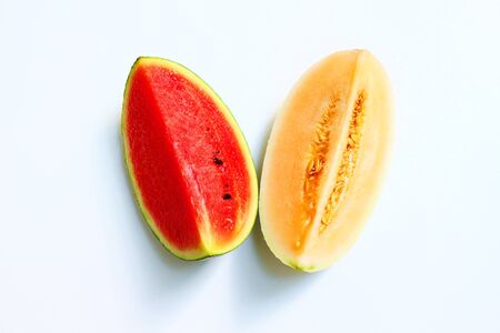 Fresh of watermelon and a piece of cantaloupe on white background.の写真素材