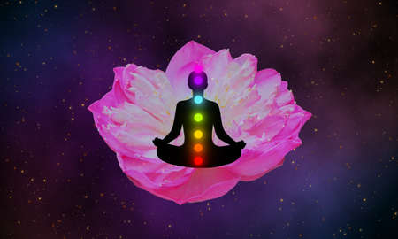 Meditation man with seven chakras and pink lotus on the galaxy design background.の写真素材