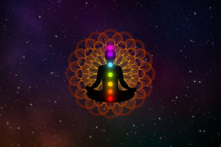 Abstract silhouette meditation man with seven chakras  and precious mandala in the galaxy.の写真素材