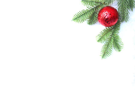 Chrismtas concept on white background with red ball and green pines.の写真素材