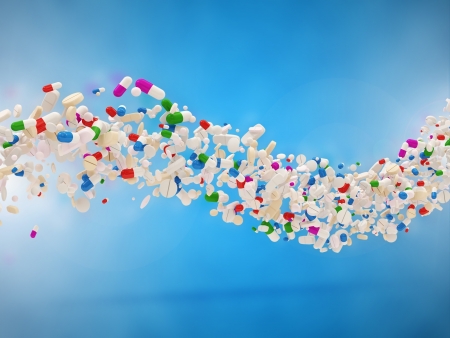 Wave from Colorful Medical Pills on blue backgroundの写真素材