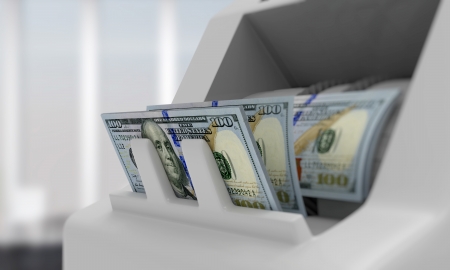 Electronic money counter with dollar billsの写真素材