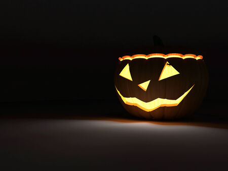 Halloween Jack O Lantern Pumpkin on dark background with Fire Light Insideの写真素材