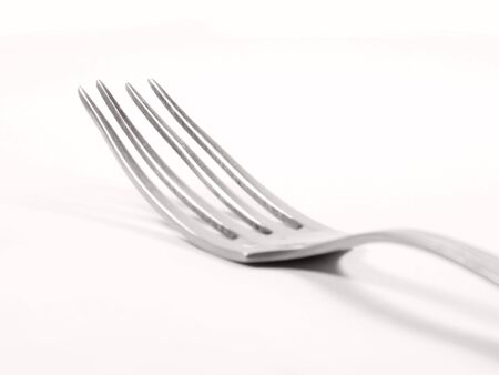 Close-up of Silver Fork isolated on white backgroundの写真素材