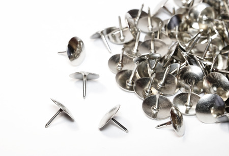 Heap of Metal Pushpin or Drawing Pin isolated on white background