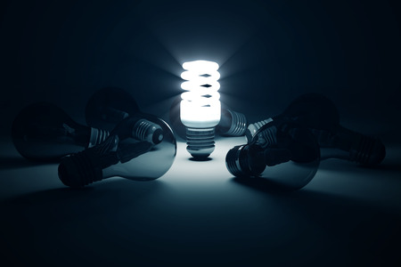 Illuminated Fluorescent Light Bulb standing out from the others Light Bulbs. Individuality Conceptual Backgroundの写真素材