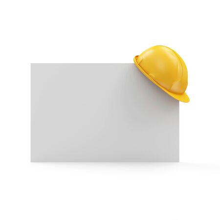 Yellow Construction Safety Helmet on a White Blank Board isolated on white backgroundの写真素材