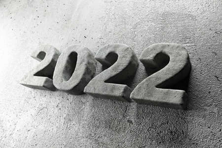 New year 2022 concrete text on grey background, closeup. Space for textの写真素材