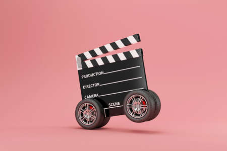 3d render of movie clapper board with wheels on pink backgroundの写真素材