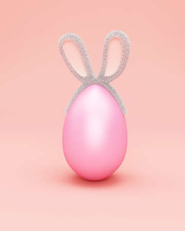 3d render of pink easter egg with bunny ears on pastel pink backgroundの写真素材