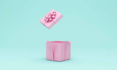 Pink gift box with pink ribbon and bow isolated on blue background. 3d renderの写真素材
