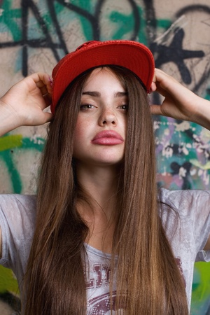 big natural lips female model posing on graffitiの写真素材