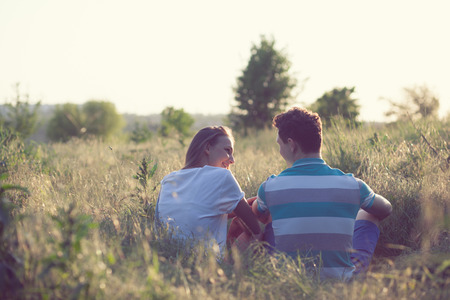 Young couple have romantic date at sunsetの写真素材