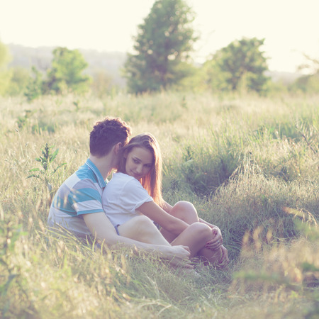 Young couple have romantic date at sunsetの写真素材
