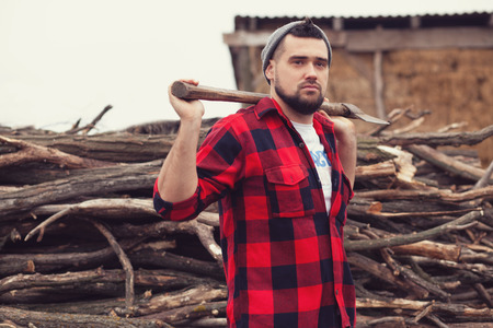 Stylish young man posing like lumberjackの写真素材
