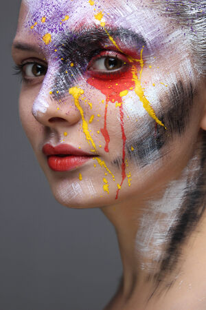 Closeup of model with colorful artistic makeupの写真素材