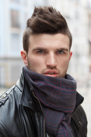 closeup portrait of stylish guy outdoorsの写真素材