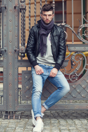Fashionable man posing in old cityの写真素材