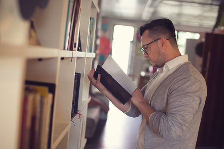 Man reading book in startup office