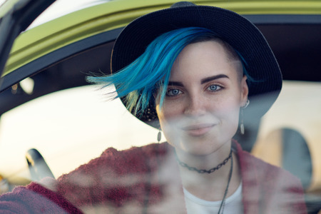 Creative person portrait in carの写真素材