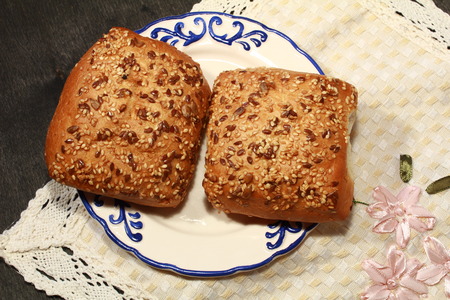Fresh homemade burger bread buns on dark wood backgroundの写真素材