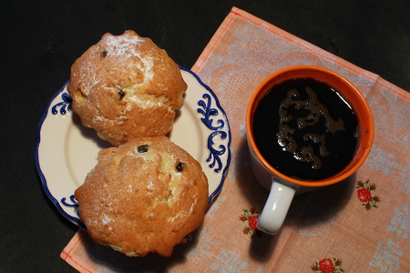 big muffin and coffee on wooden backgroundの写真素材