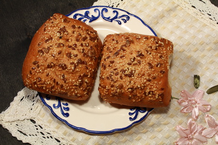 Fresh homemade burger bread buns on dark wood backgroundの写真素材