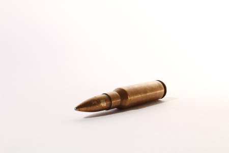 medium caliber automatic rifle ammo on white background