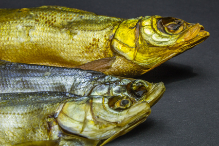 dried fish, beer snack on black background.の写真素材