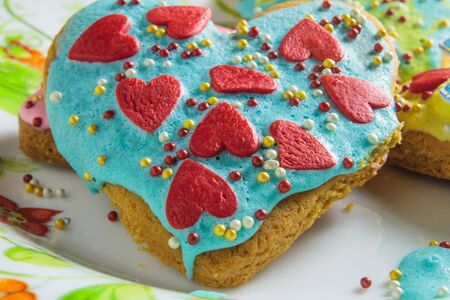 Valentine cookies in the shape of heart on black background