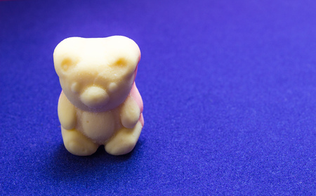 Gummy bear sweet candy on blue backgroundの写真素材