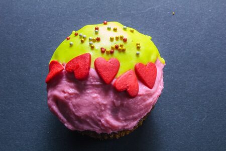Cupcakes with sweet color cream on black backgroundの写真素材