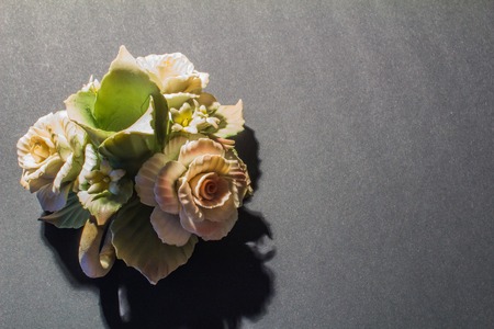 green ceramic candlestick rose on black backgroundの写真素材