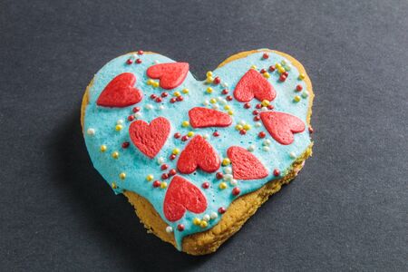 Valentine cookies in the shape of heart on black backgroundの写真素材