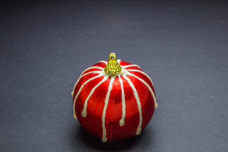 red christmas stripes ball on black backgroundの写真素材