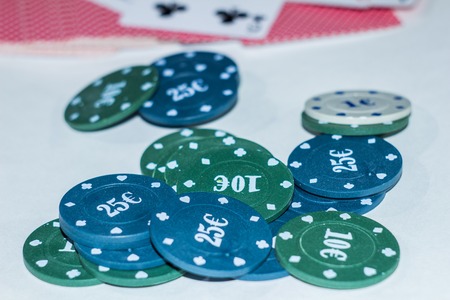Green, blue chips and cards for poker
