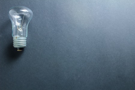 glass electric light bulb on a dark backgroundの写真素材