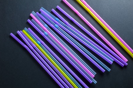 colored tubules for a cocktail on a dark backgroundの写真素材