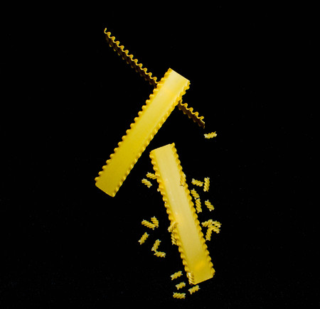 dried italian pasta on black backgroundの写真素材