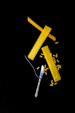 Pasta made of cooked with fork and knife