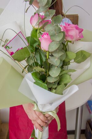 Woman holding a beautiful bouquetの写真素材