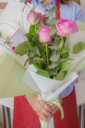 Woman holding a beautiful bouquetの写真素材