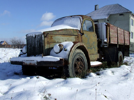 Old truck covered with snowの写真素材