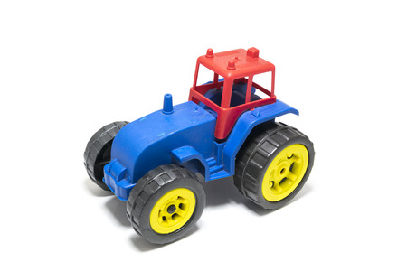 Colorful toy tractor isolated on white background.の写真素材