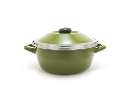 Used green cast iron cooking pot, isolated on white background.の写真素材