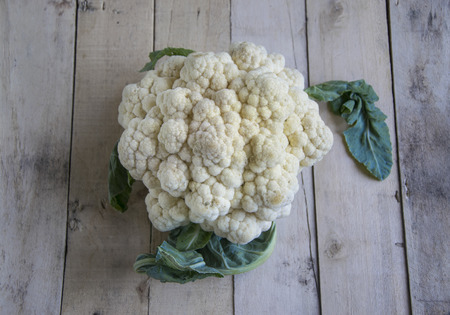 Organic cauliflower on wooden background.の写真素材