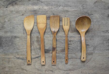 Wooden cutlery on old , wooden, rusty background.の写真素材